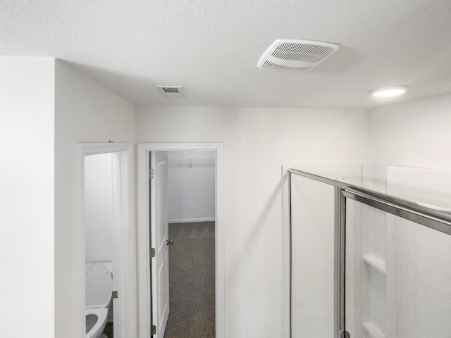 interior space featuring a textured ceiling