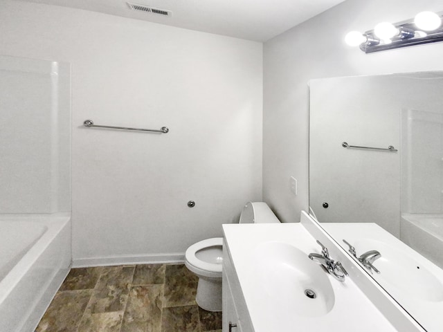 bathroom featuring toilet and sink