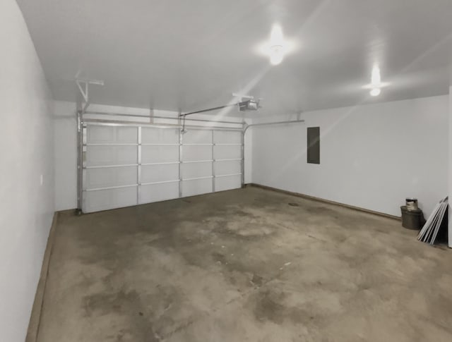 garage featuring a garage door opener and electric panel