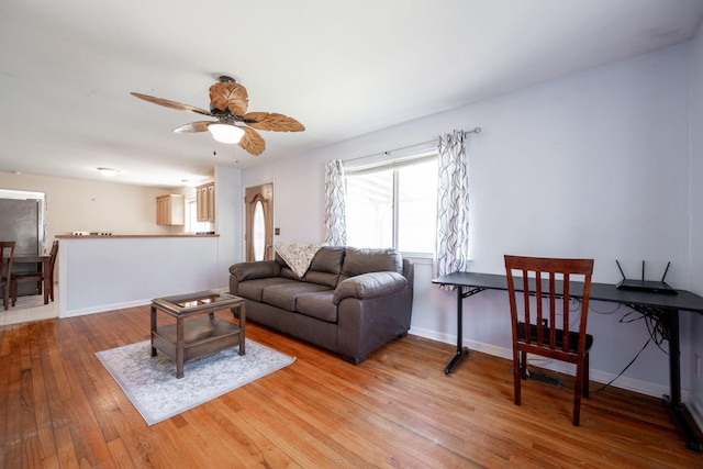 living room with hardwood / wood-style floors and ceiling fan