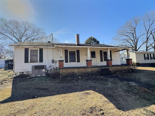 view of front of house with cooling unit and covered porch