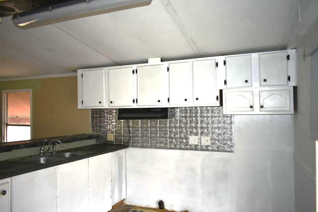 kitchen with sink and white cabinets