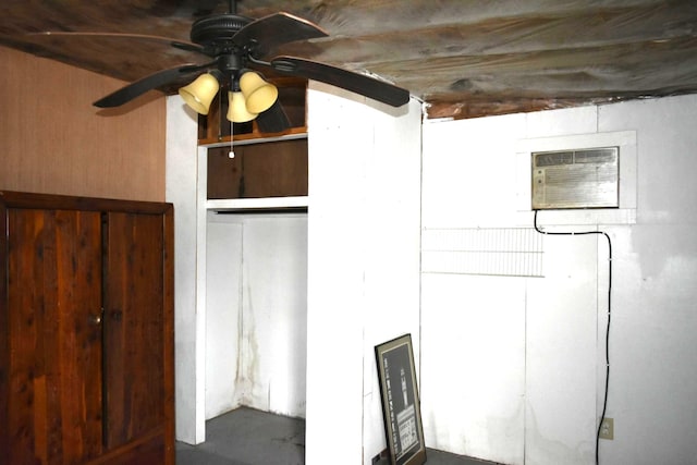 interior space featuring ceiling fan and a wall mounted air conditioner