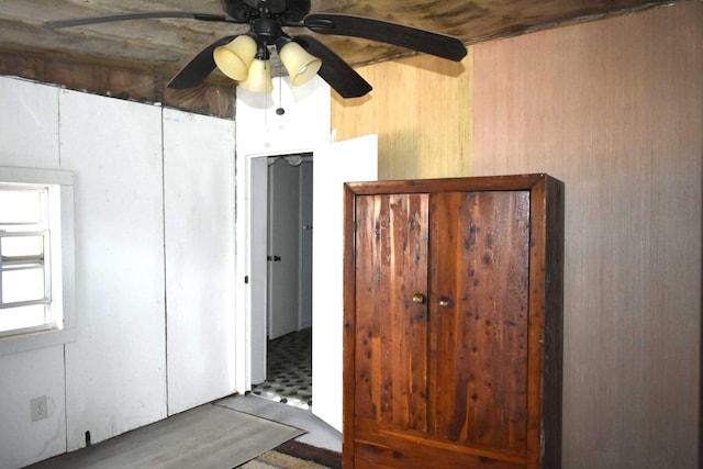 interior space featuring ceiling fan