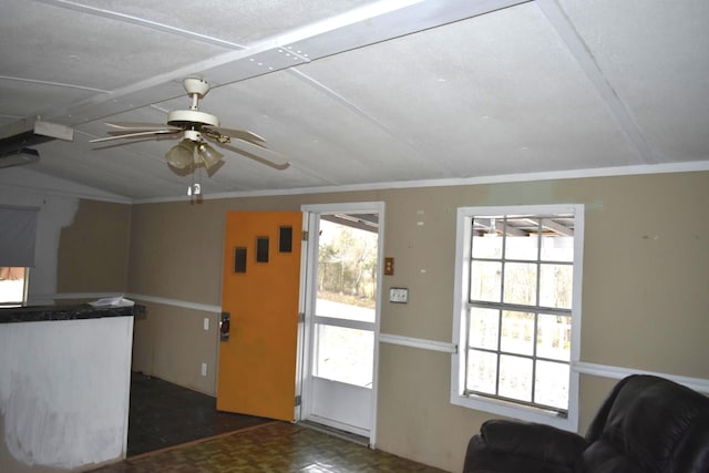 interior space featuring ornamental molding and ceiling fan