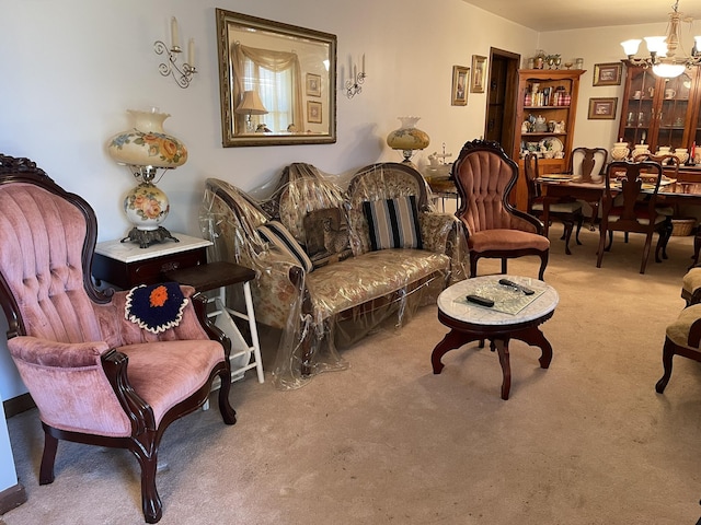 living area featuring carpet floors and a notable chandelier