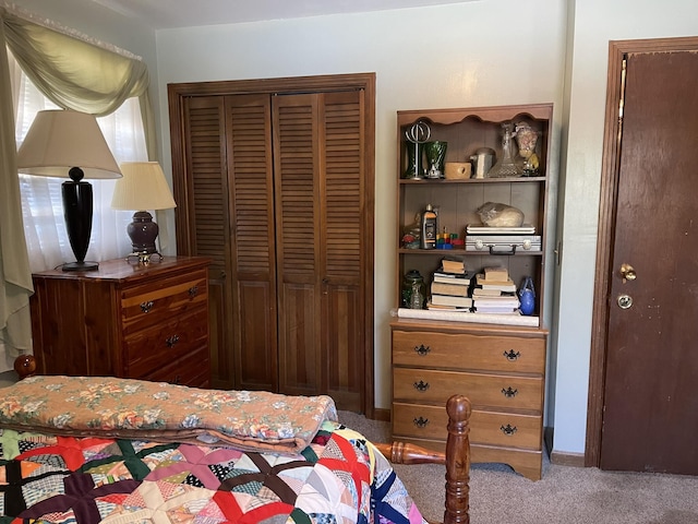 carpeted bedroom featuring a closet