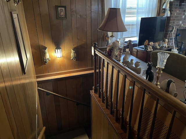 staircase with wooden walls