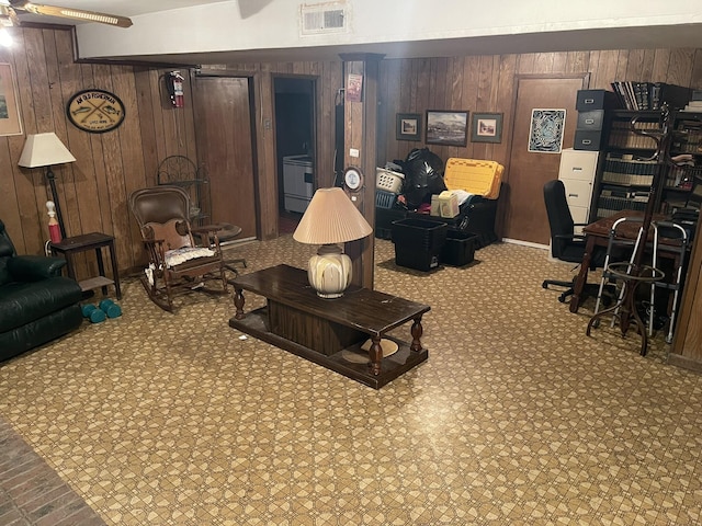 living room featuring wood walls