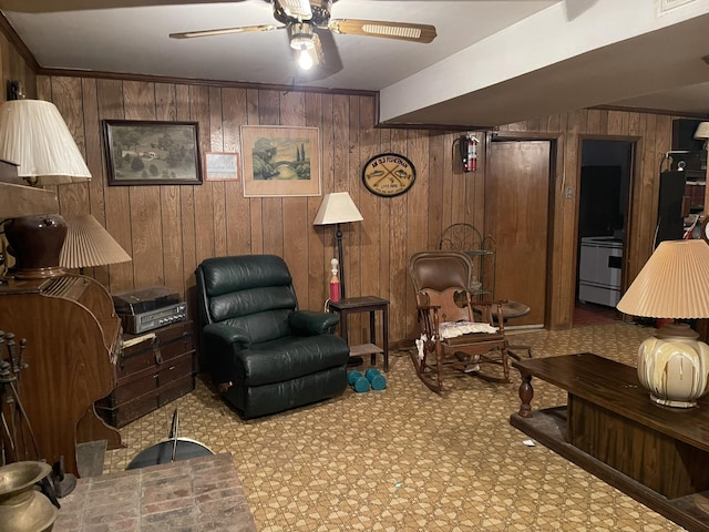 living room featuring ceiling fan and wood walls