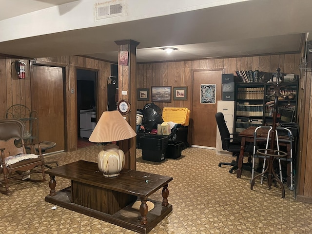 interior space featuring crown molding and wood walls