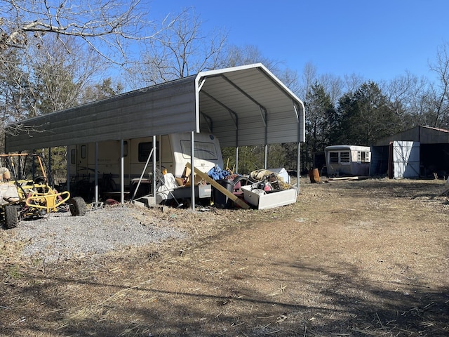 view of parking / parking lot with a carport