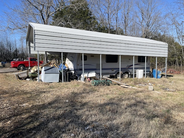 view of parking / parking lot featuring a carport