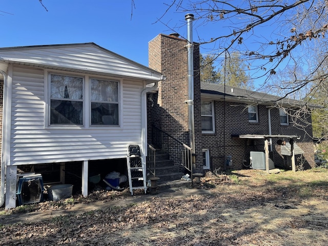 back of property with central air condition unit