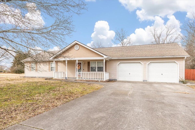 ranch-style home featuring a garage, covered porch, and a front lawn