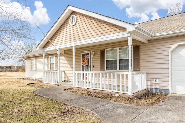 view of front of home with a garage and covered porch