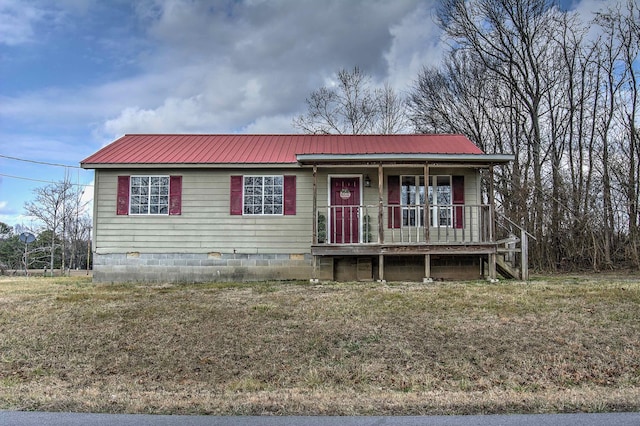 view of front of property with a front yard and a porch