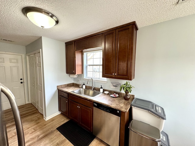 kitchen featuring light hardwood / wood-style floors, dishwasher, sink, and dark brown cabinets