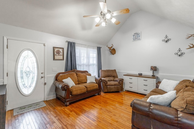 living room featuring a wealth of natural light, light hardwood / wood-style flooring, and ceiling fan