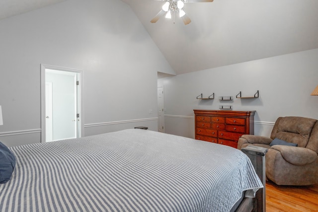 bedroom with ceiling fan, high vaulted ceiling, and light hardwood / wood-style floors