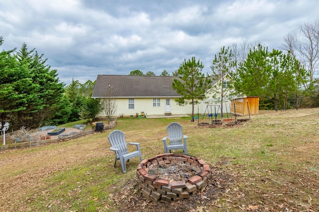 view of yard with an outdoor fire pit