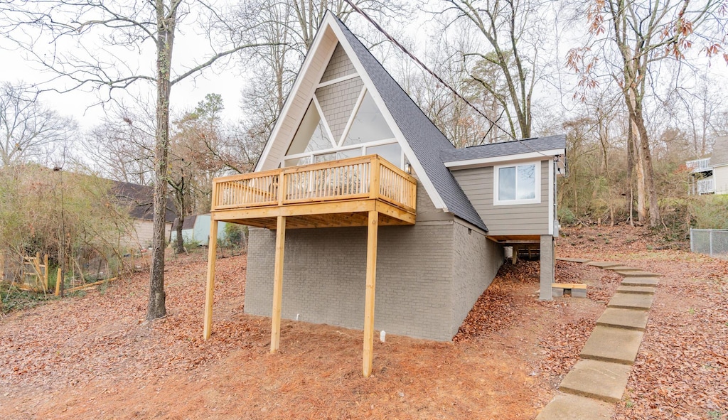 back of house with a wooden deck