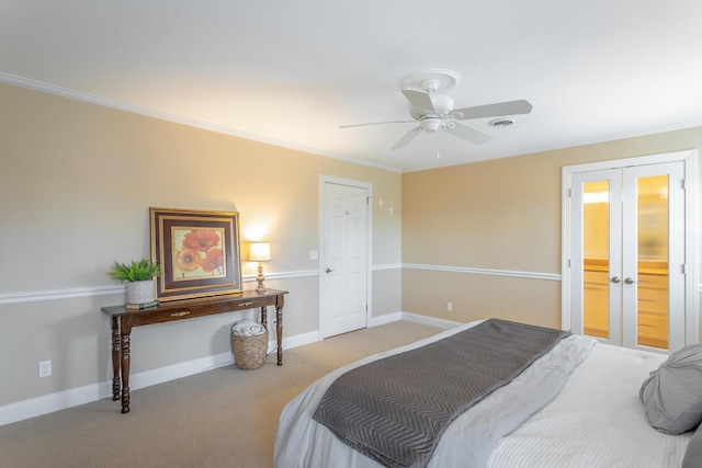 bedroom featuring crown molding, light colored carpet, ceiling fan, and french doors