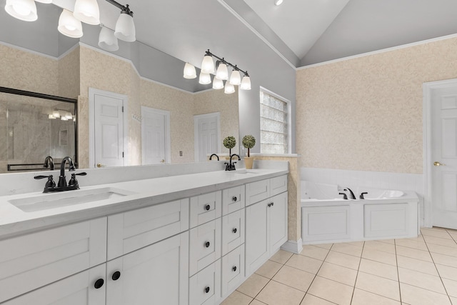 bathroom featuring lofted ceiling, a tub to relax in, vanity, ornamental molding, and tile patterned flooring