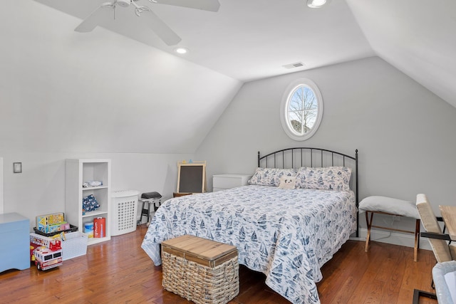 bedroom featuring hardwood / wood-style flooring, lofted ceiling, and ceiling fan