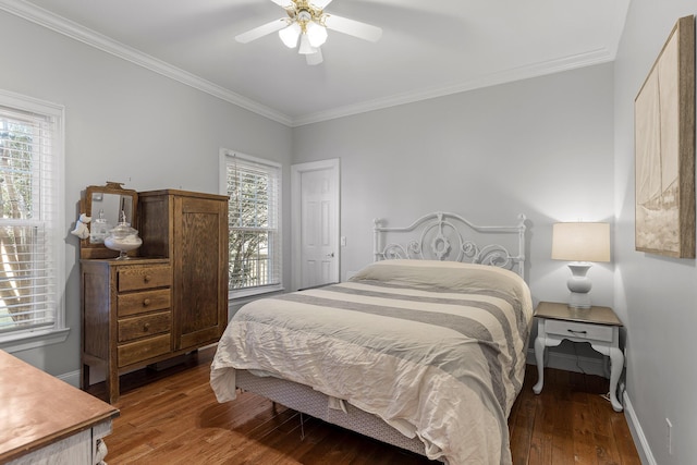 bedroom featuring hardwood / wood-style floors, crown molding, and ceiling fan