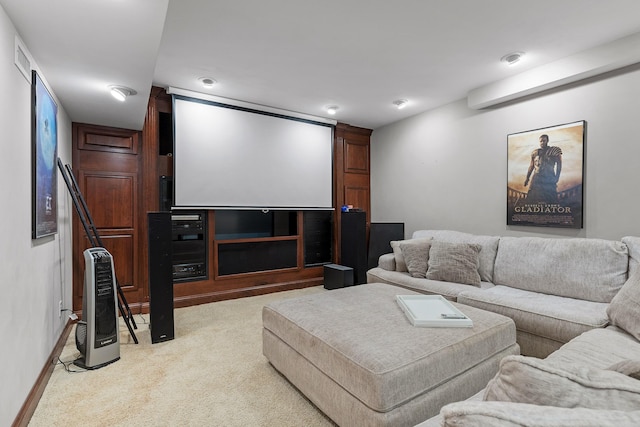 carpeted home theater room featuring heating unit