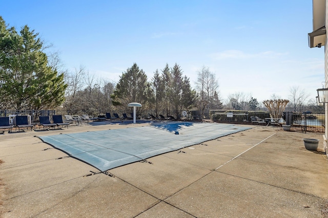 view of swimming pool featuring a patio area