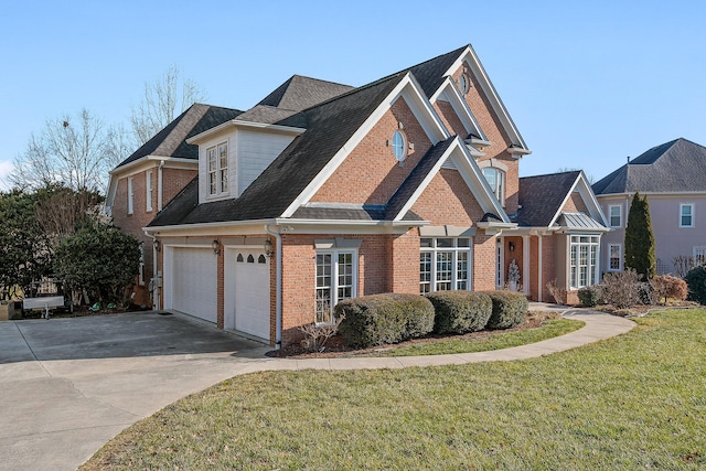 view of front of property featuring a garage and a front yard