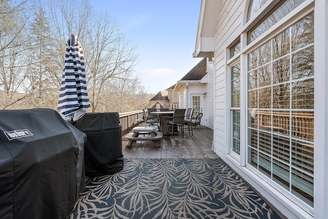 view of patio / terrace featuring a wooden deck and a grill