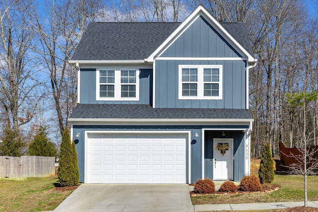 view of front of home featuring a garage and a front lawn