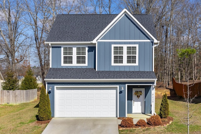 front facade featuring a garage and a front lawn