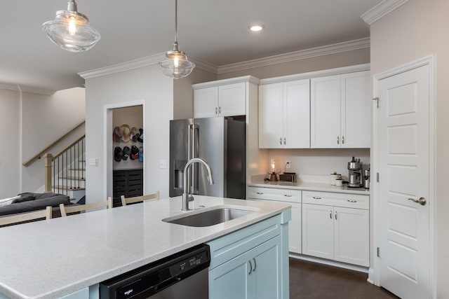 kitchen with white cabinetry, appliances with stainless steel finishes, sink, and pendant lighting