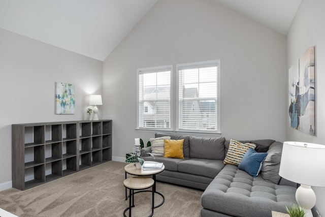 living room featuring high vaulted ceiling and carpet floors