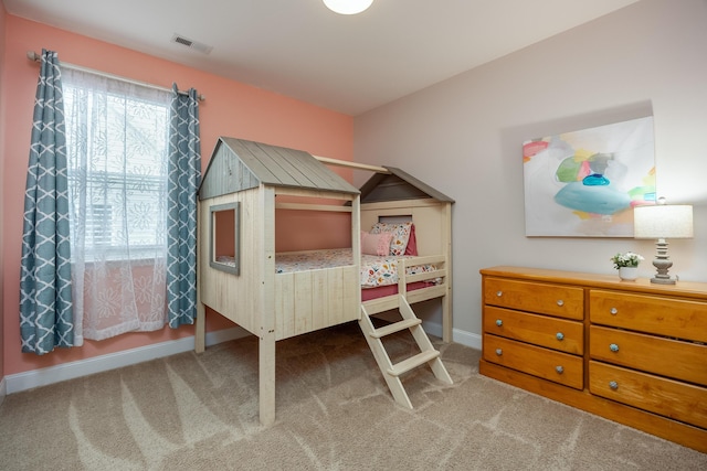 bedroom with light carpet