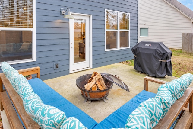 view of patio / terrace with a grill and an outdoor living space with a fire pit