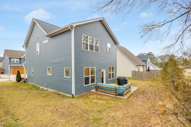 rear view of property with a yard