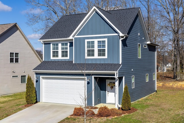 view of front of home featuring a garage and a front yard