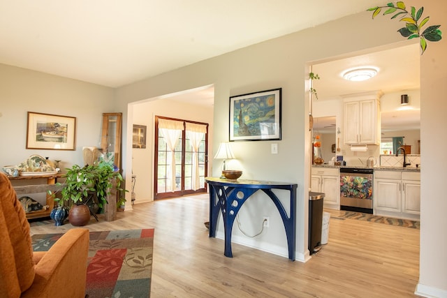 interior space with sink and light hardwood / wood-style flooring