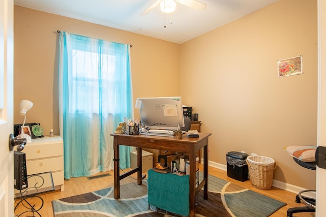 office space with ceiling fan and light wood-type flooring