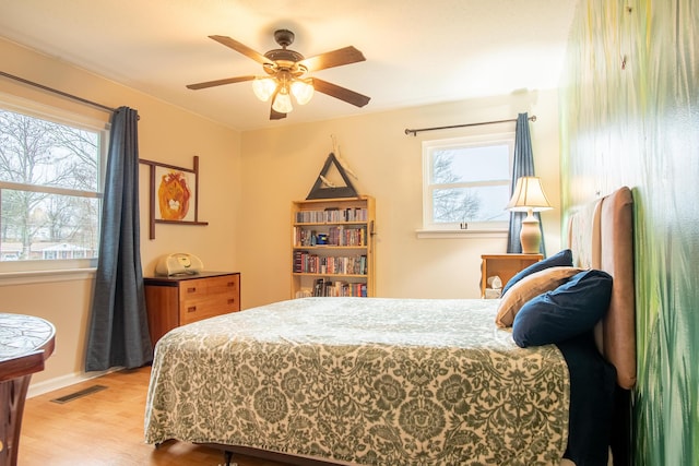 bedroom featuring hardwood / wood-style flooring and ceiling fan