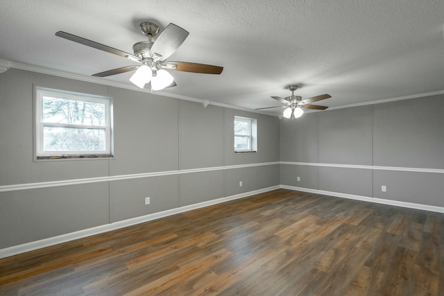 spare room with crown molding and dark hardwood / wood-style floors