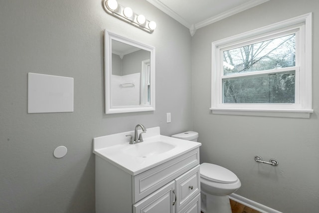 bathroom with vanity, hardwood / wood-style floors, ornamental molding, and toilet