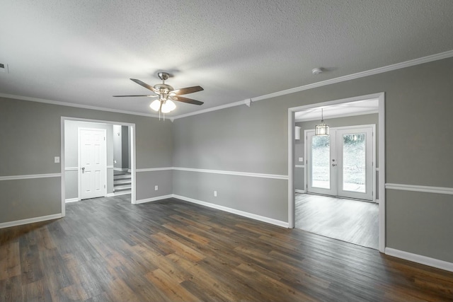 unfurnished room with ornamental molding, dark hardwood / wood-style floors, and a textured ceiling