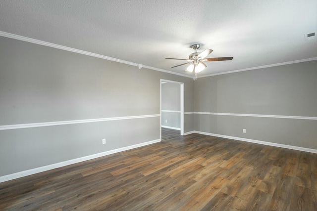 spare room with dark wood-type flooring, ceiling fan, crown molding, and a textured ceiling