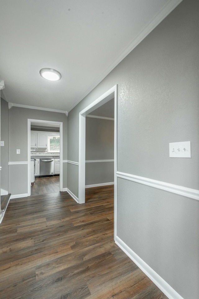 hall featuring dark hardwood / wood-style flooring and ornamental molding